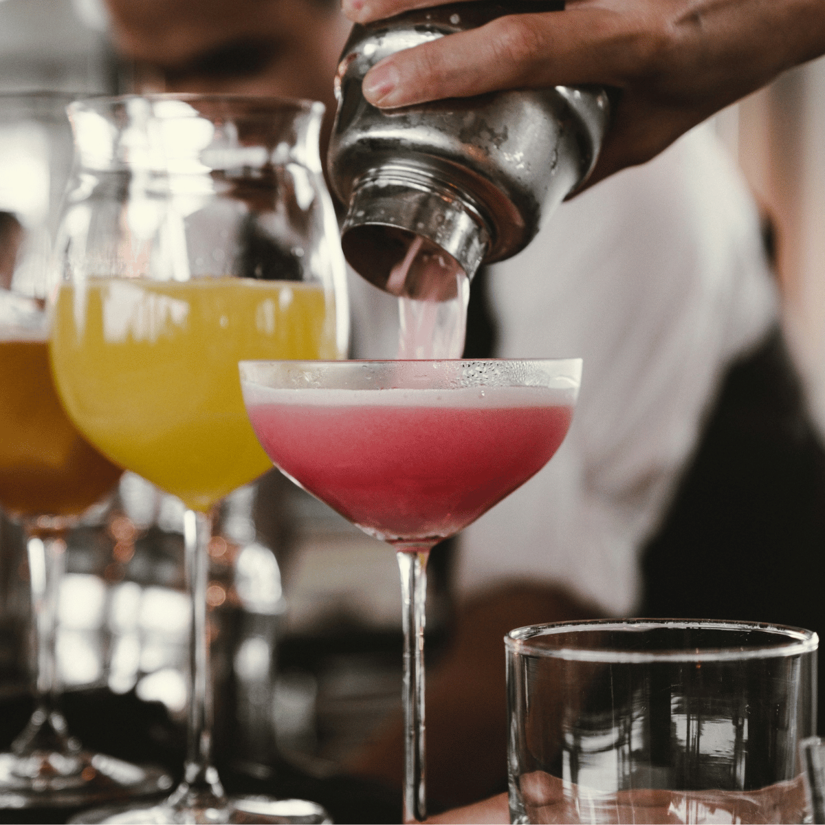 Bartender pouring cocktails